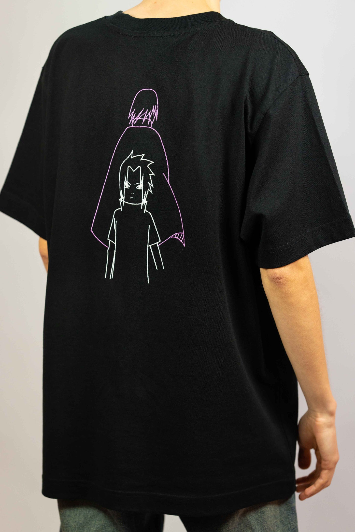 Unisex organic cotton t-shirt featuring Sasuke Uchiha design in premium quality.