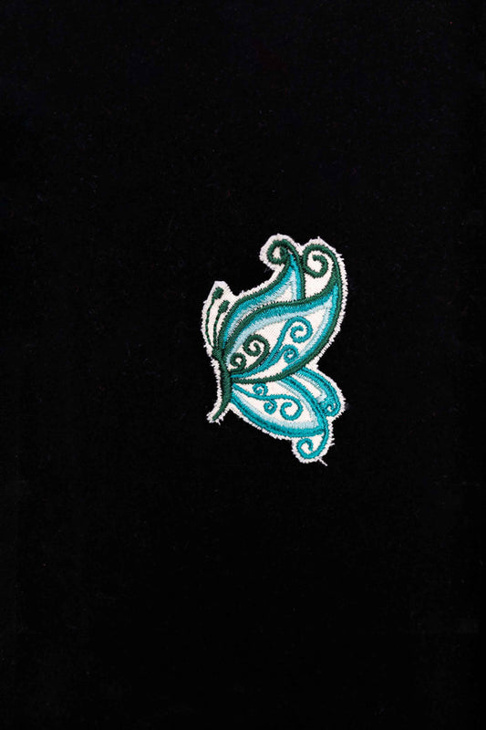 An embroidered butterfly brooch, representing transformation and beauty. A delicate and stylish handmade accessory!