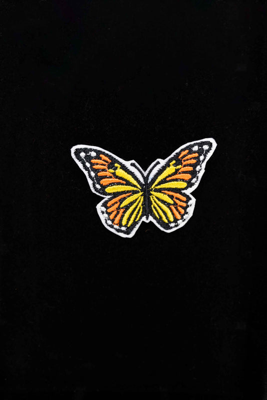An embroidered butterfly brooch, representing transformation and beauty. A delicate and stylish handmade accessory!