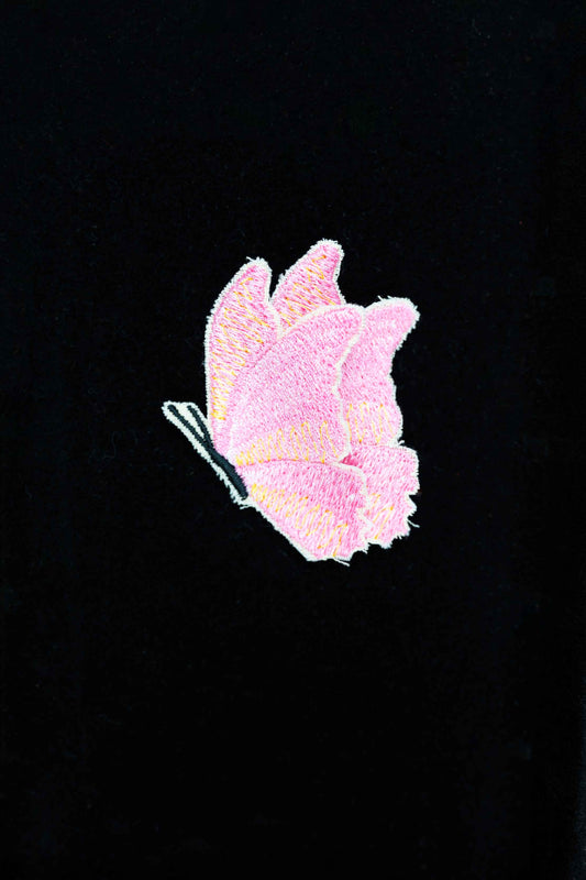 An embroidered butterfly brooch, representing transformation and beauty. A delicate and stylish handmade accessory!