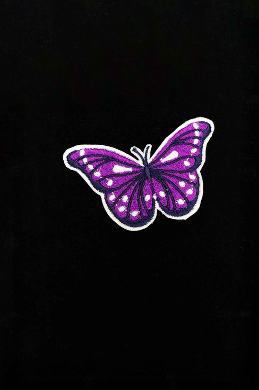 An embroidered butterfly brooch, representing transformation and beauty. A delicate and stylish handmade accessory!