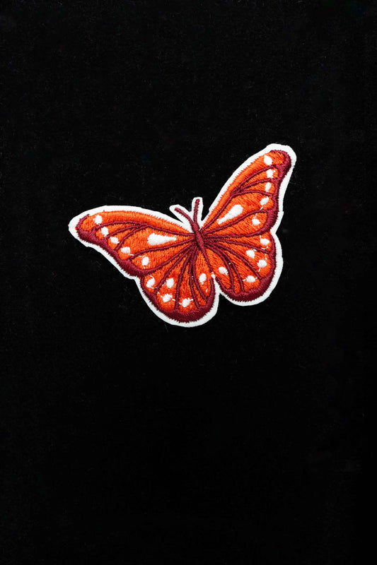An embroidered butterfly brooch, representing transformation and beauty. A delicate and stylish handmade accessory!