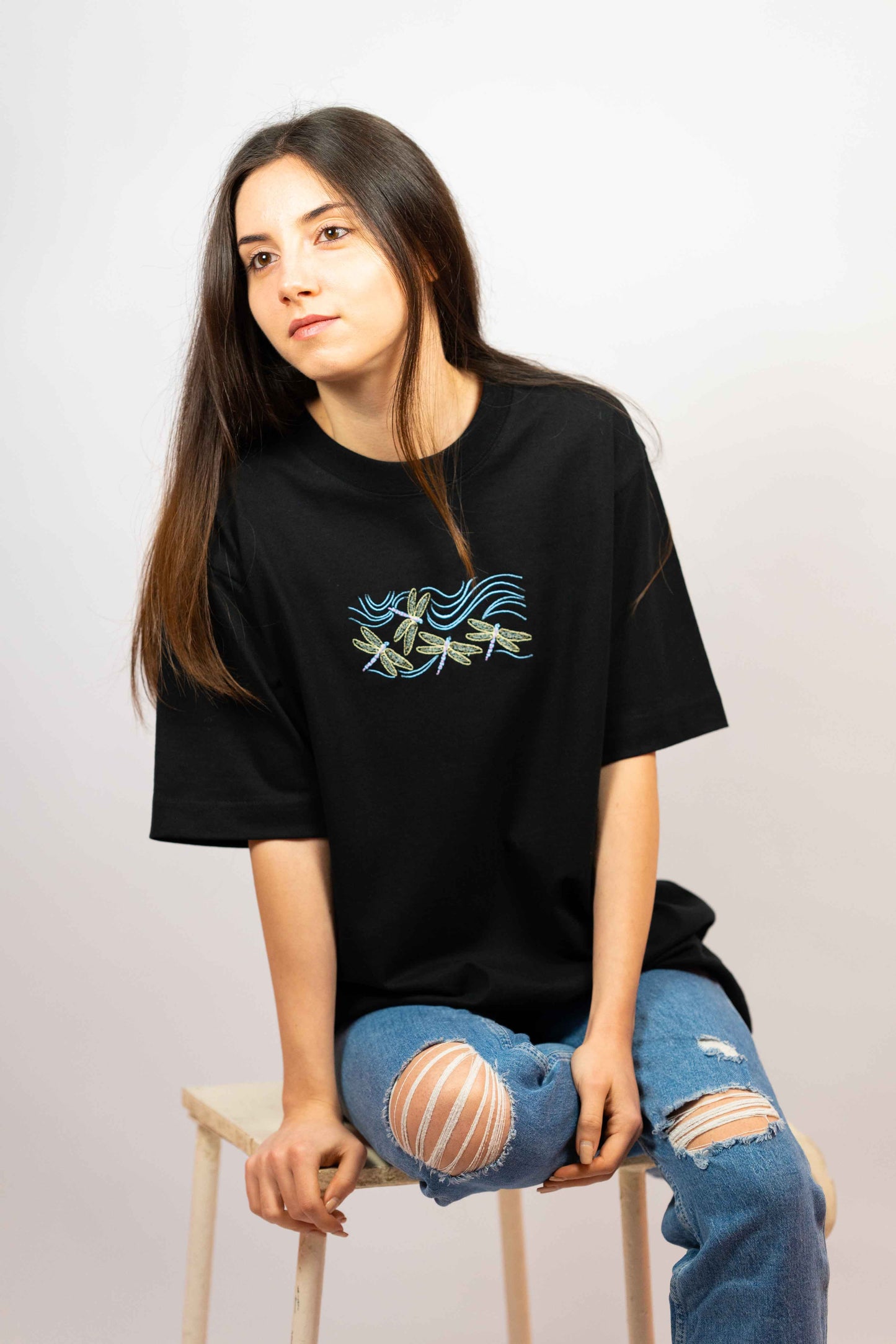 Premium cotton T-shirt for women with a stylish dragonfly design.