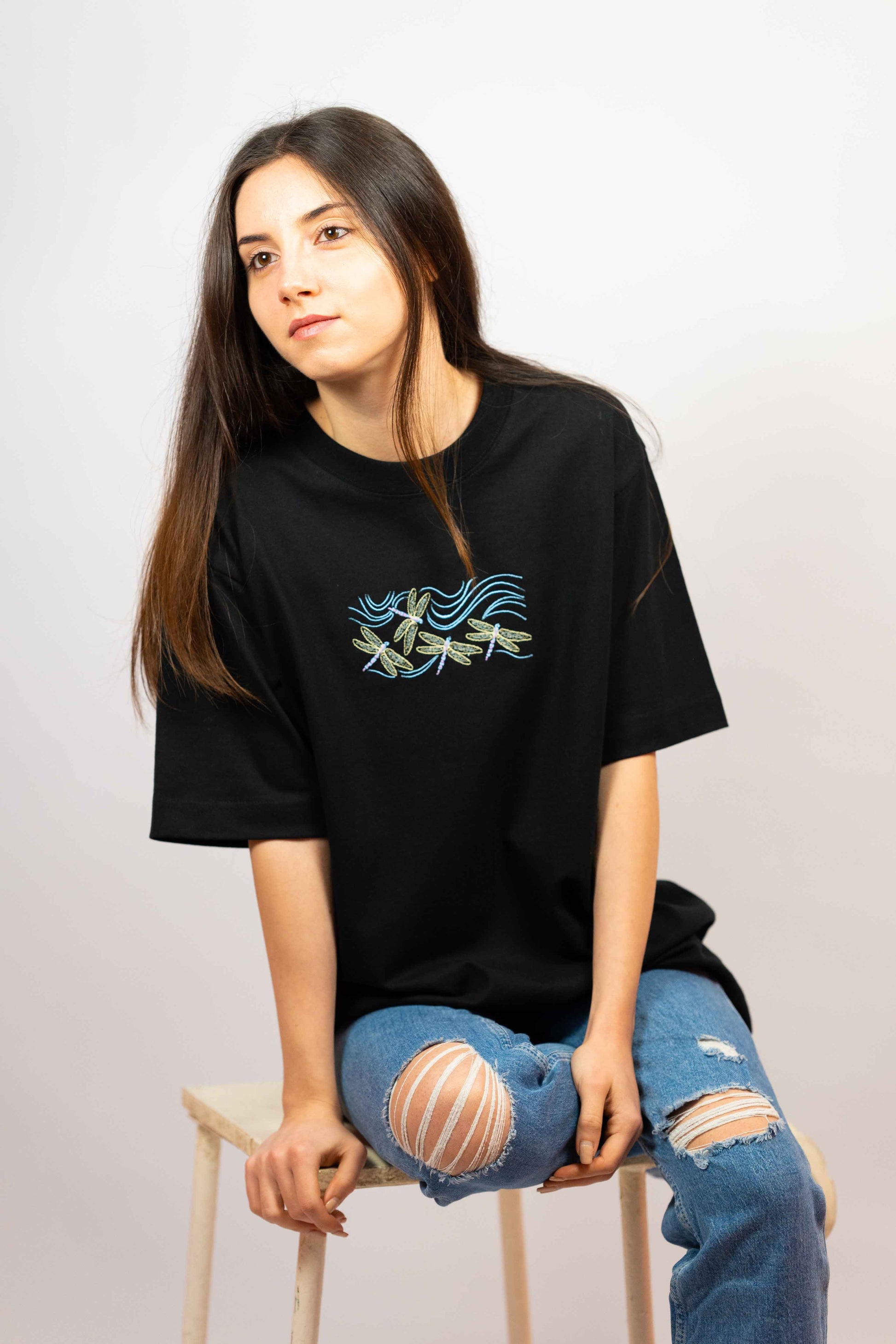 Premium cotton T-shirt for women with a stylish dragonfly design.