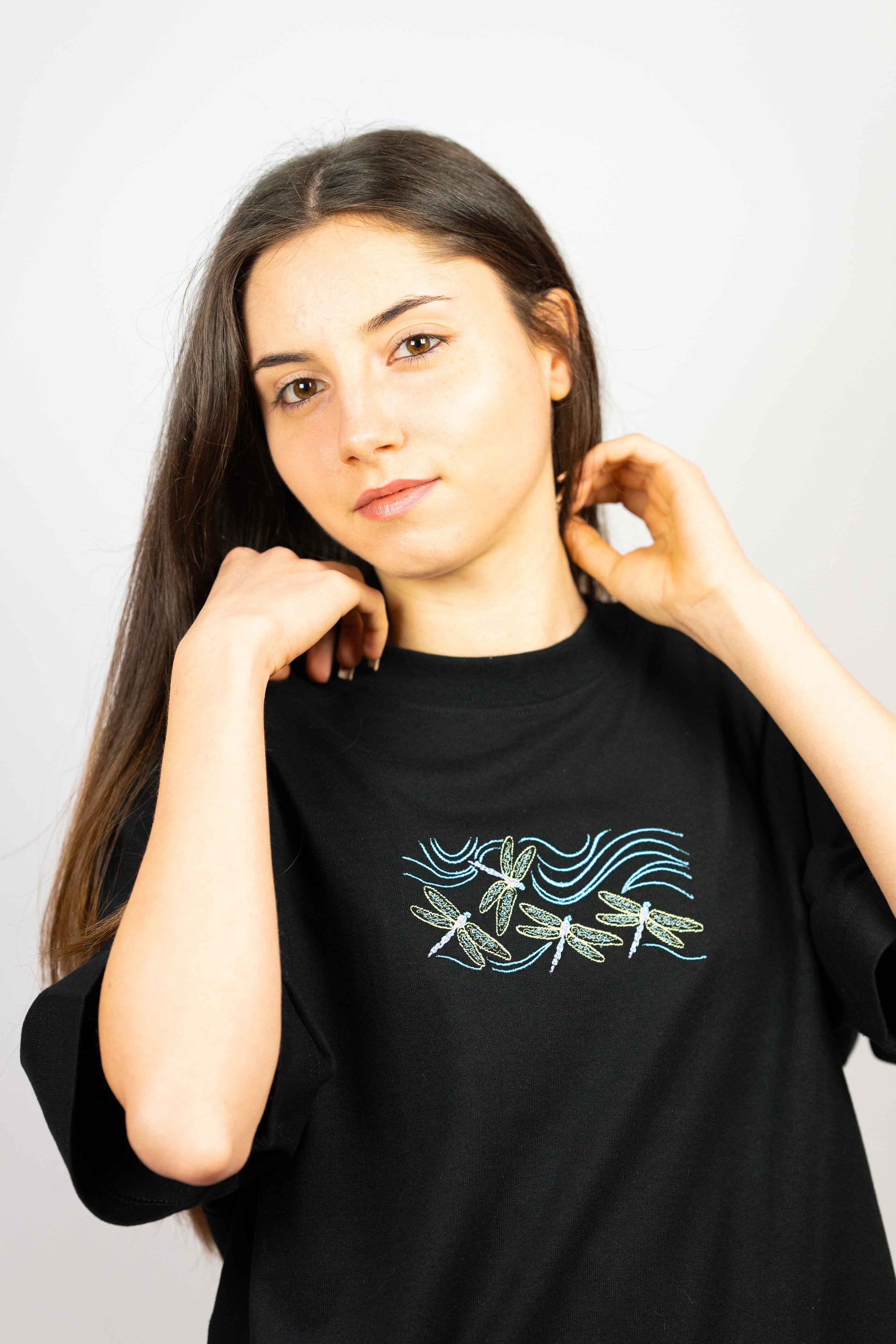 Dragonfly embroidered luxury unisex t-shirt, combining artful design with sustainable fabric.