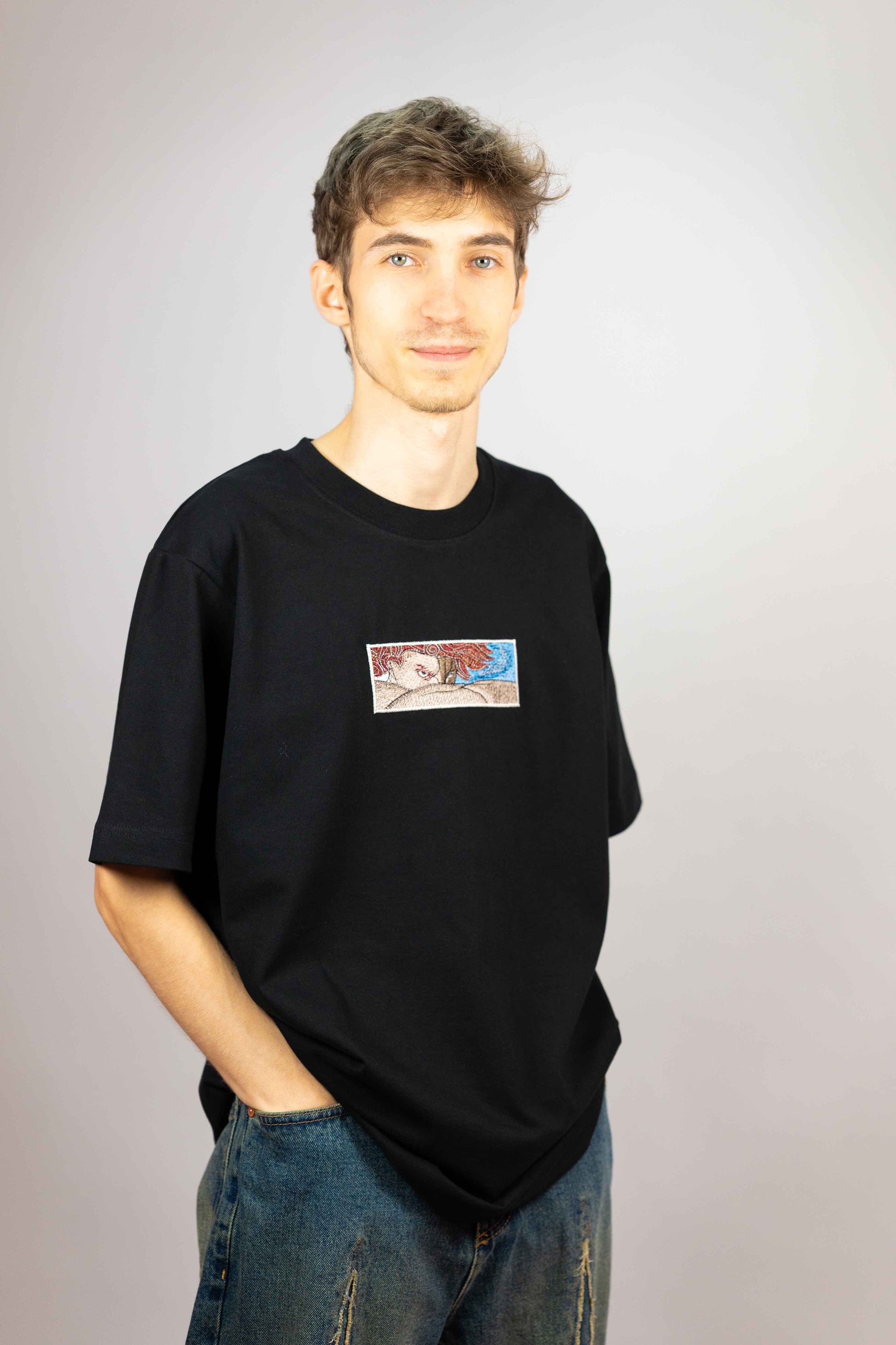 Premium unisex T-shirt crafted from organic cotton with Fallen Angel embroidery.