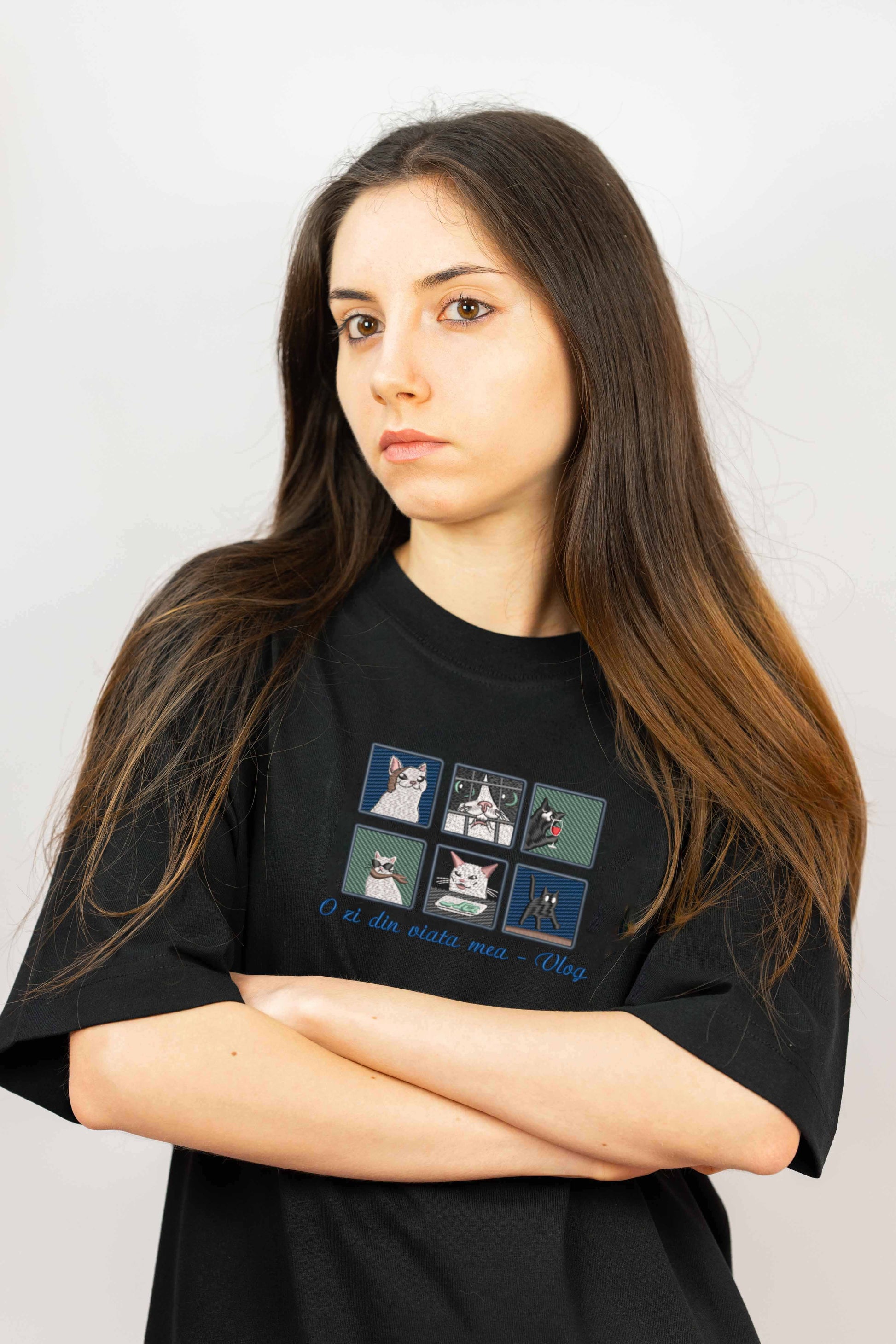 A playful cotton t-shirt with a detailed embroidery of six illustrated cats in different daily situations. A cozy and stylish pick for pet lovers.