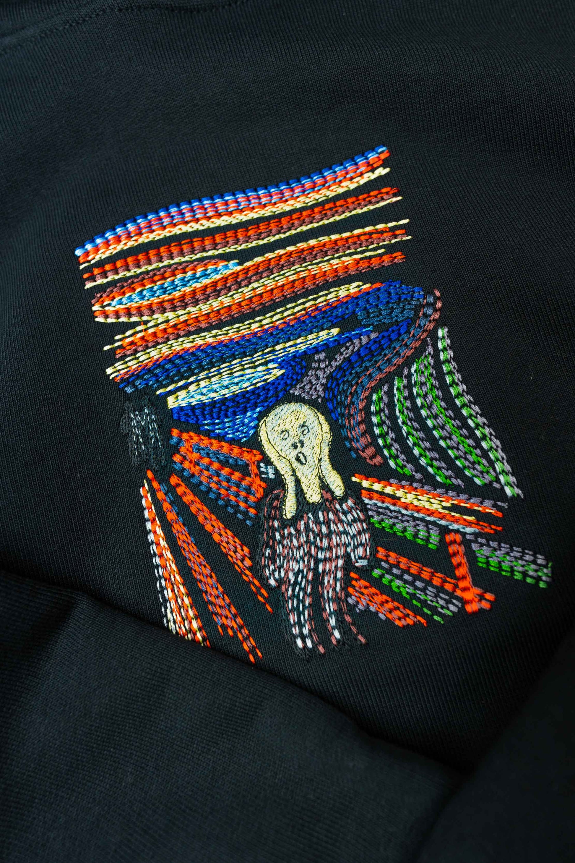 Hoodie featuring "The Scream" embroidery, crafted from heavyweight organic cotton, with an oversized unisex fit and kangaroo pocket.