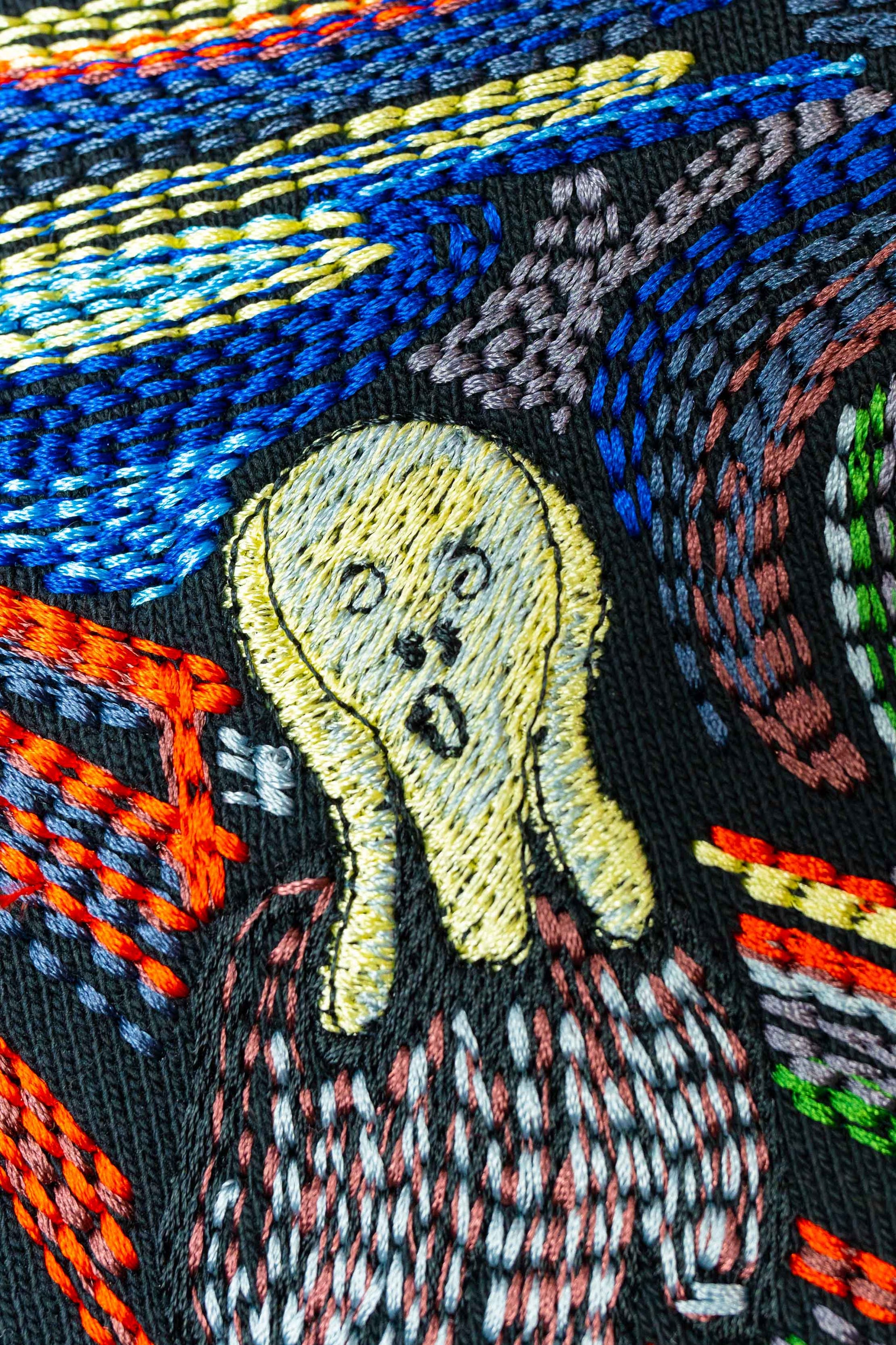 Unisex oversized hoodie with "The Scream" embroidery, made of 100% organic cotton, French terry fabric, and 2x1 ribbed sleeves.