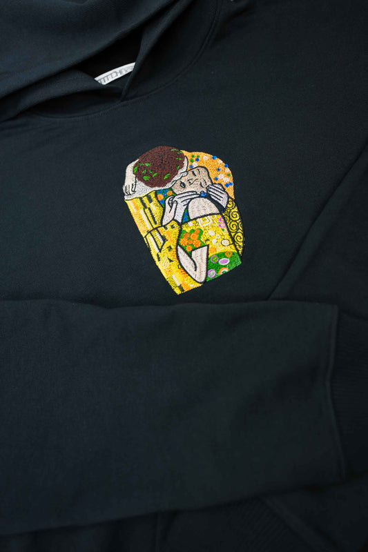 Luxury heavyweight hoodie featuring "The Kiss" embroidery by Gustav Klimt, made from 100% organic cotton with an oversized unisex fit