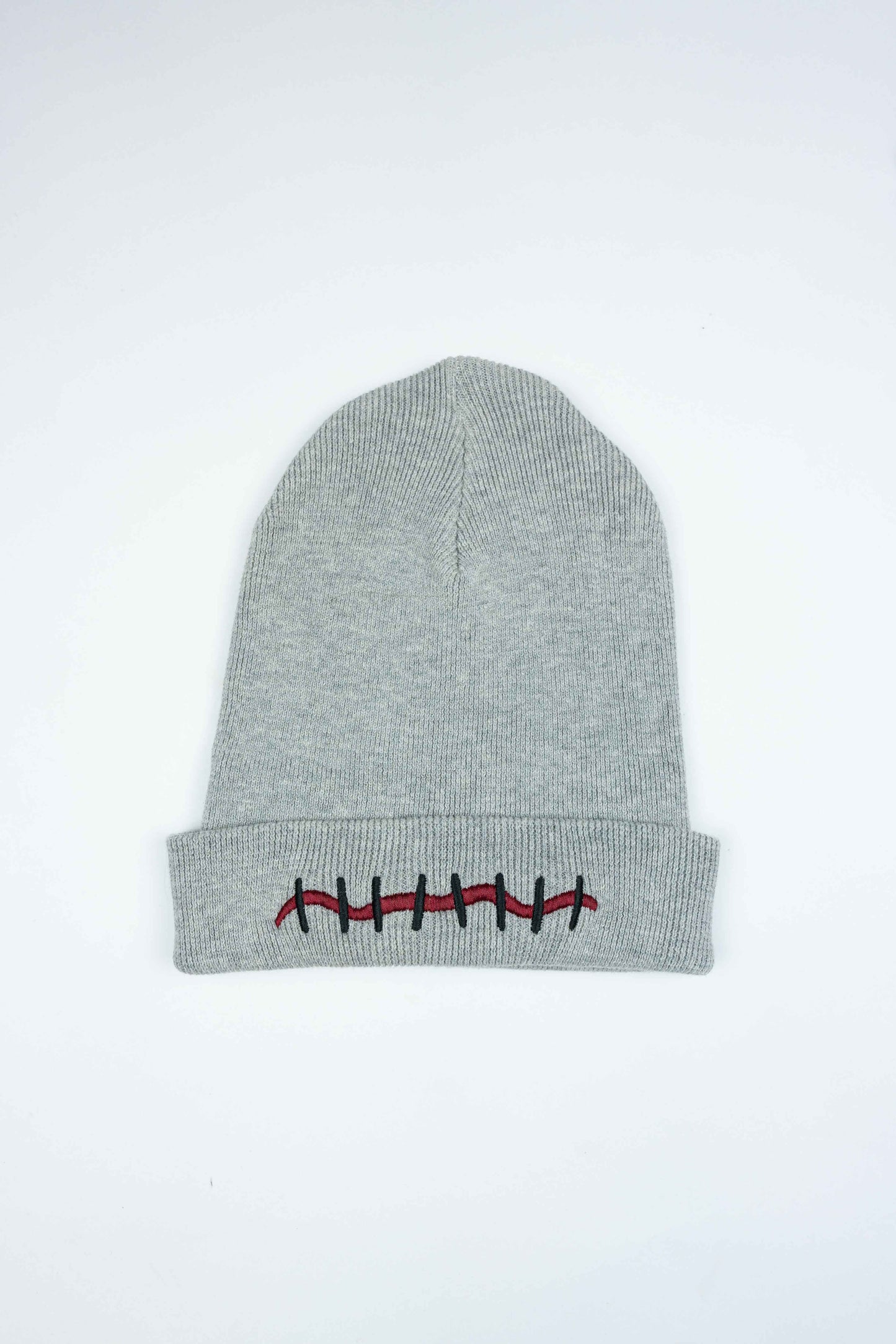 Luxury gray organic cotton beanie with unique Mouth Scar design.