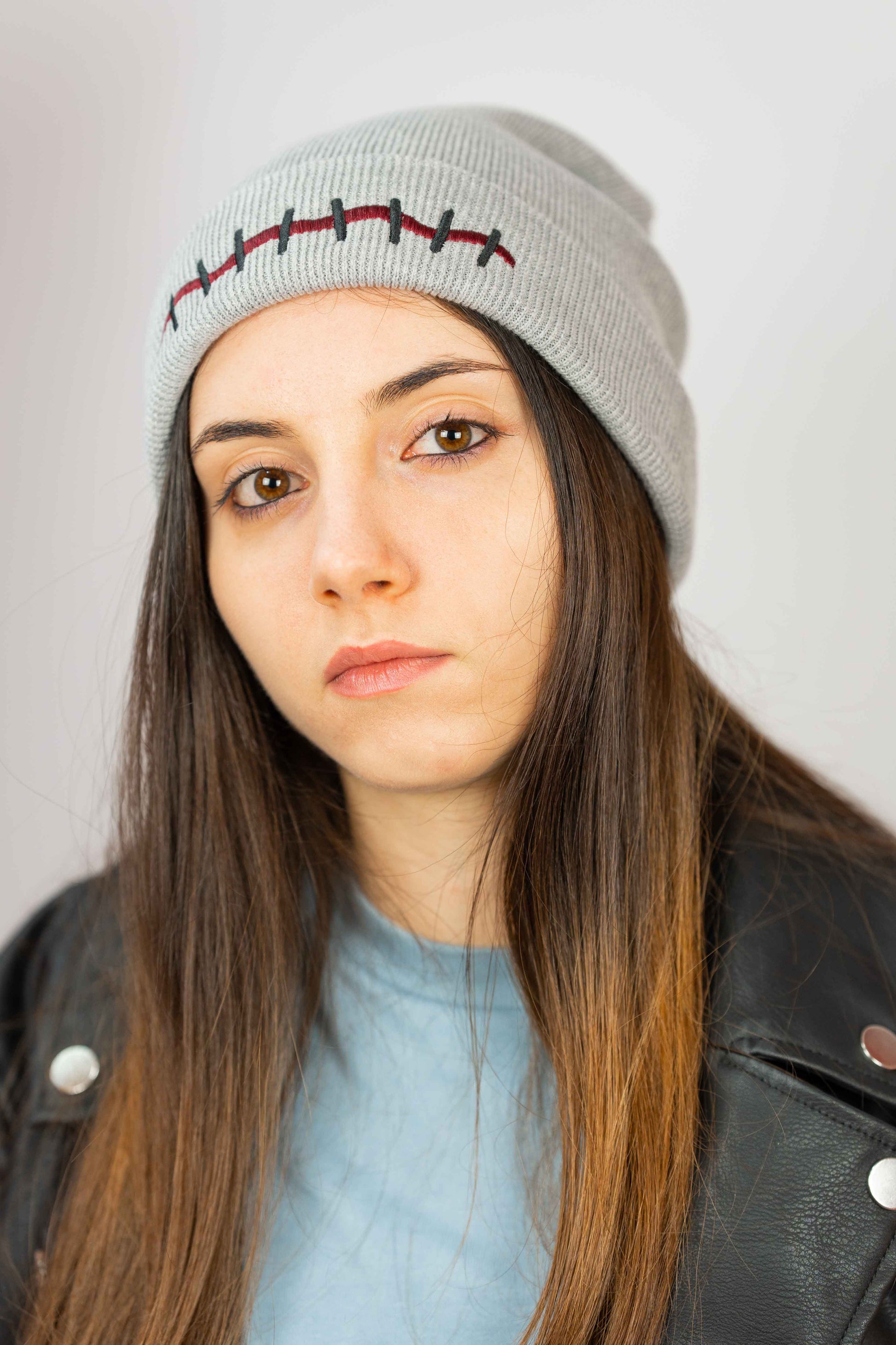 Premium organic cotton beanie featuring bold Mouth Scar artwork.