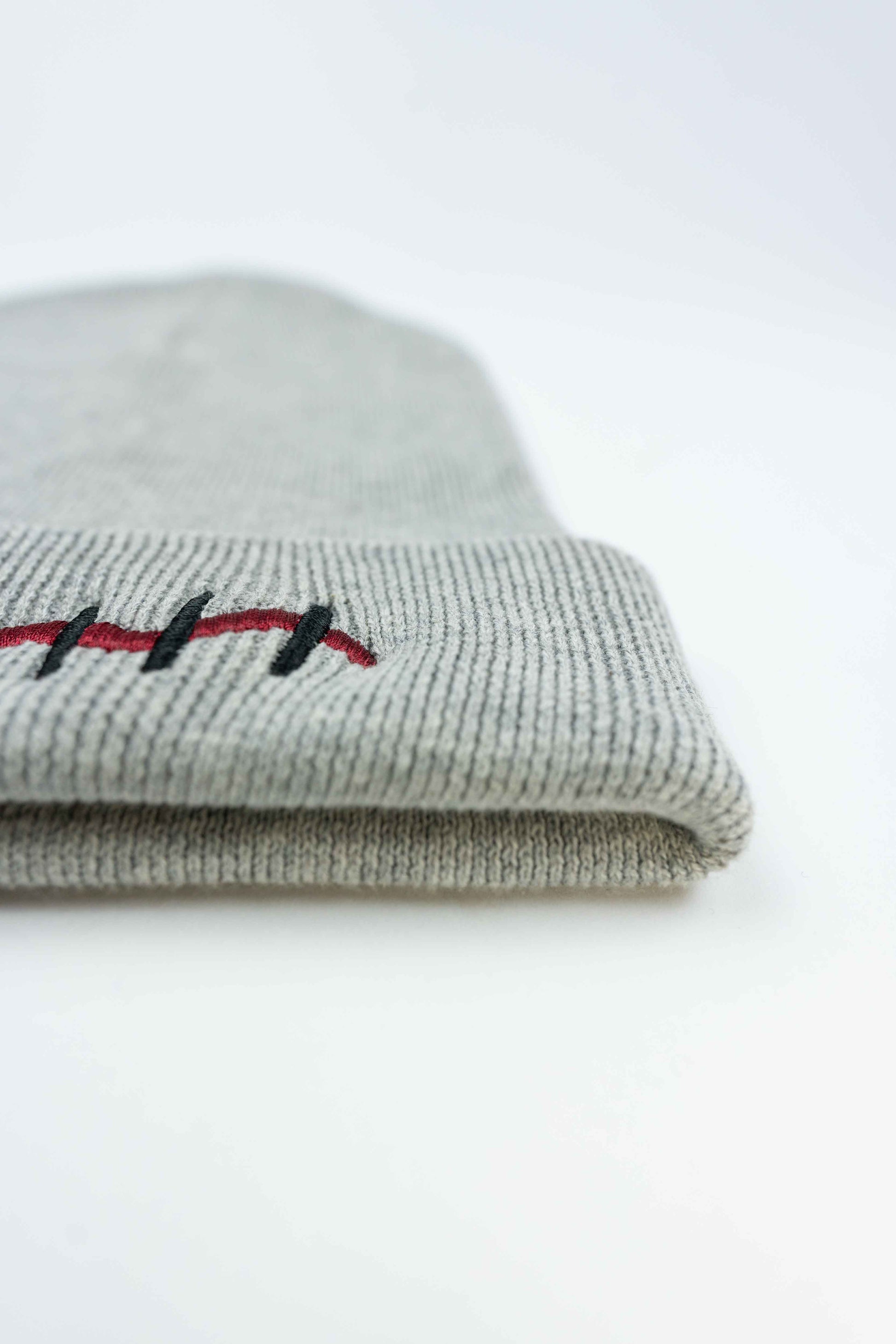 Soft organic cotton gray beanie with distinctive Mouth Scar design for all.
