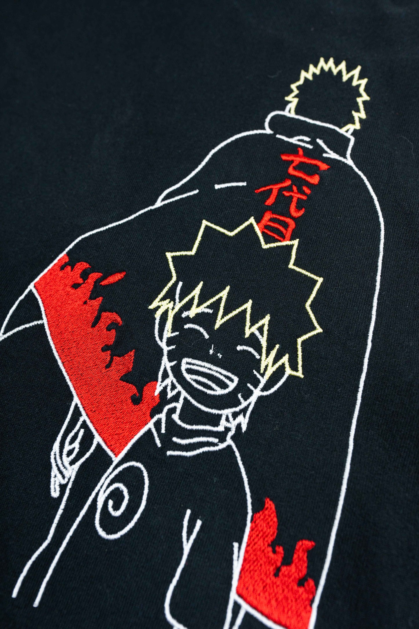 Eco-friendly organic cotton t-shirt with an iconic Naruto embroidery for a bold, stylish look.