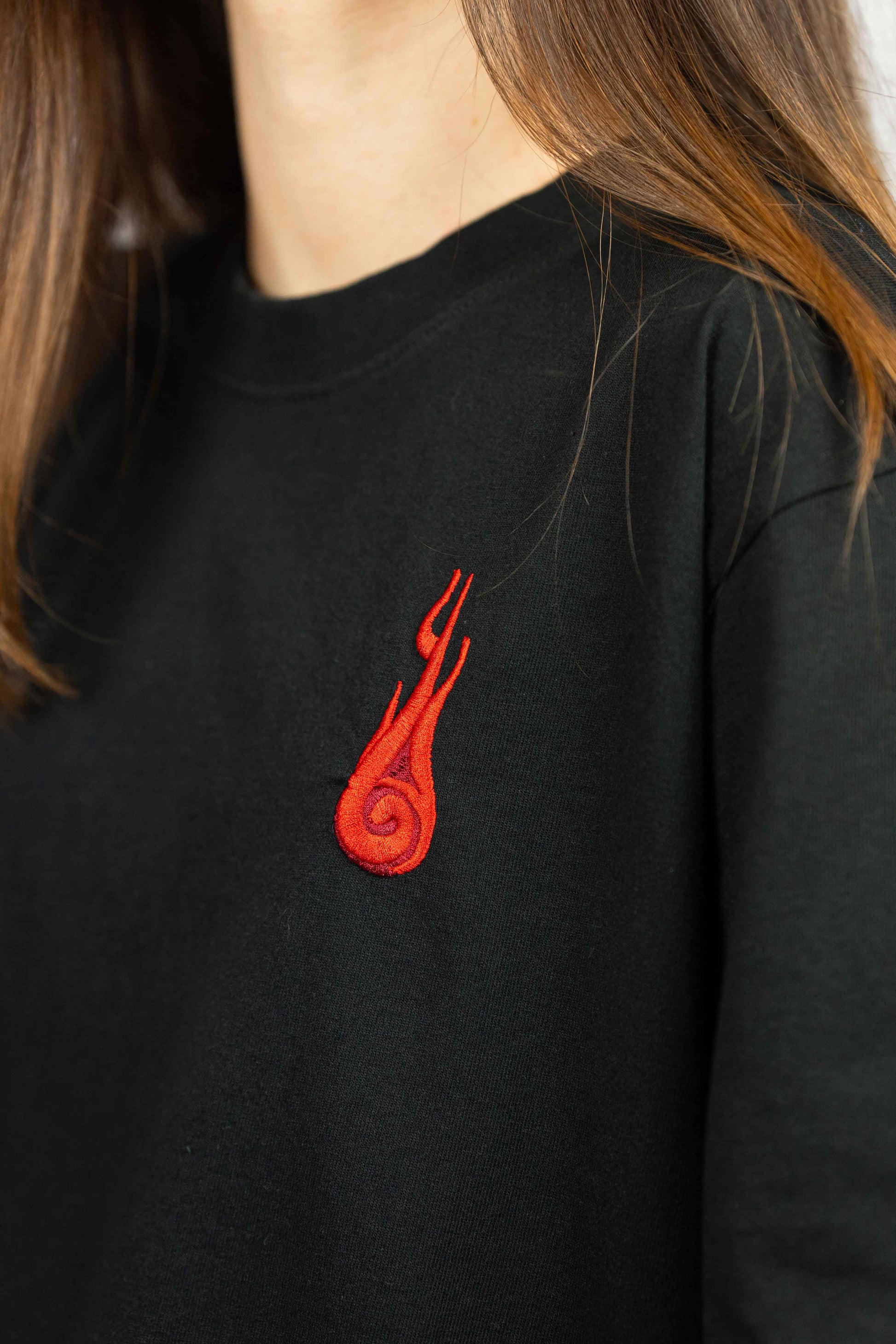 Organic cotton unisex t-shirt with detailed Naruto artwork and comfortable feel.