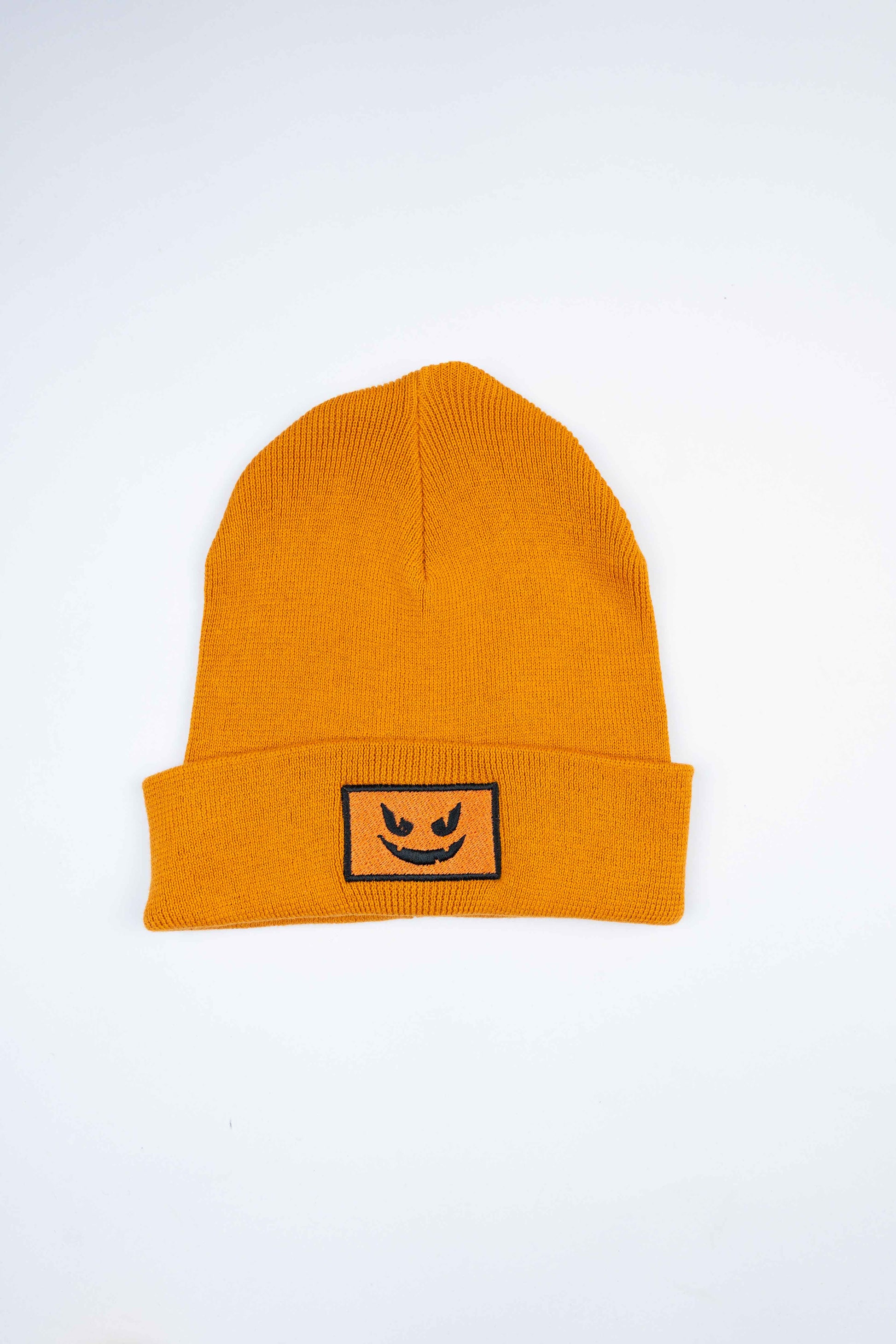 Organic cotton beanie with a classic Pumpkin Face design in soft fabric.