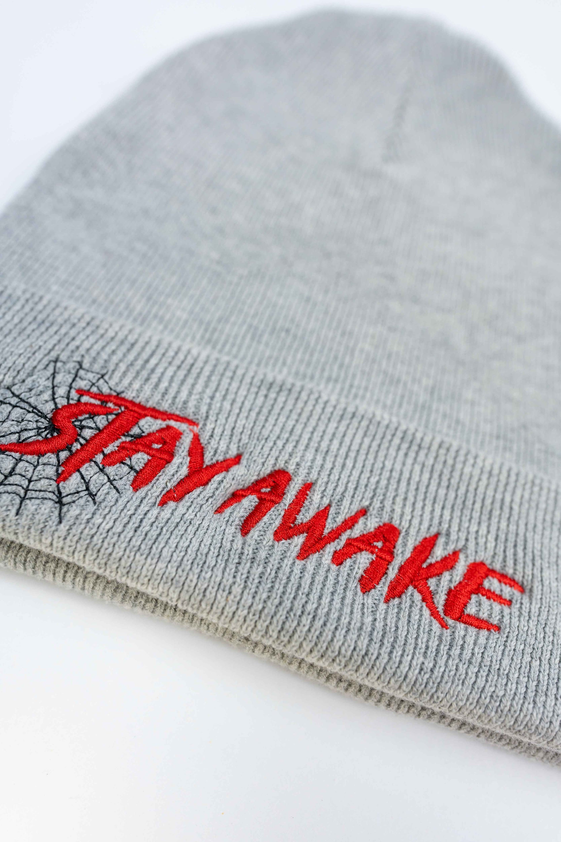 Unisex gray beanie crafted from organic cotton with Stay Awake lettering.