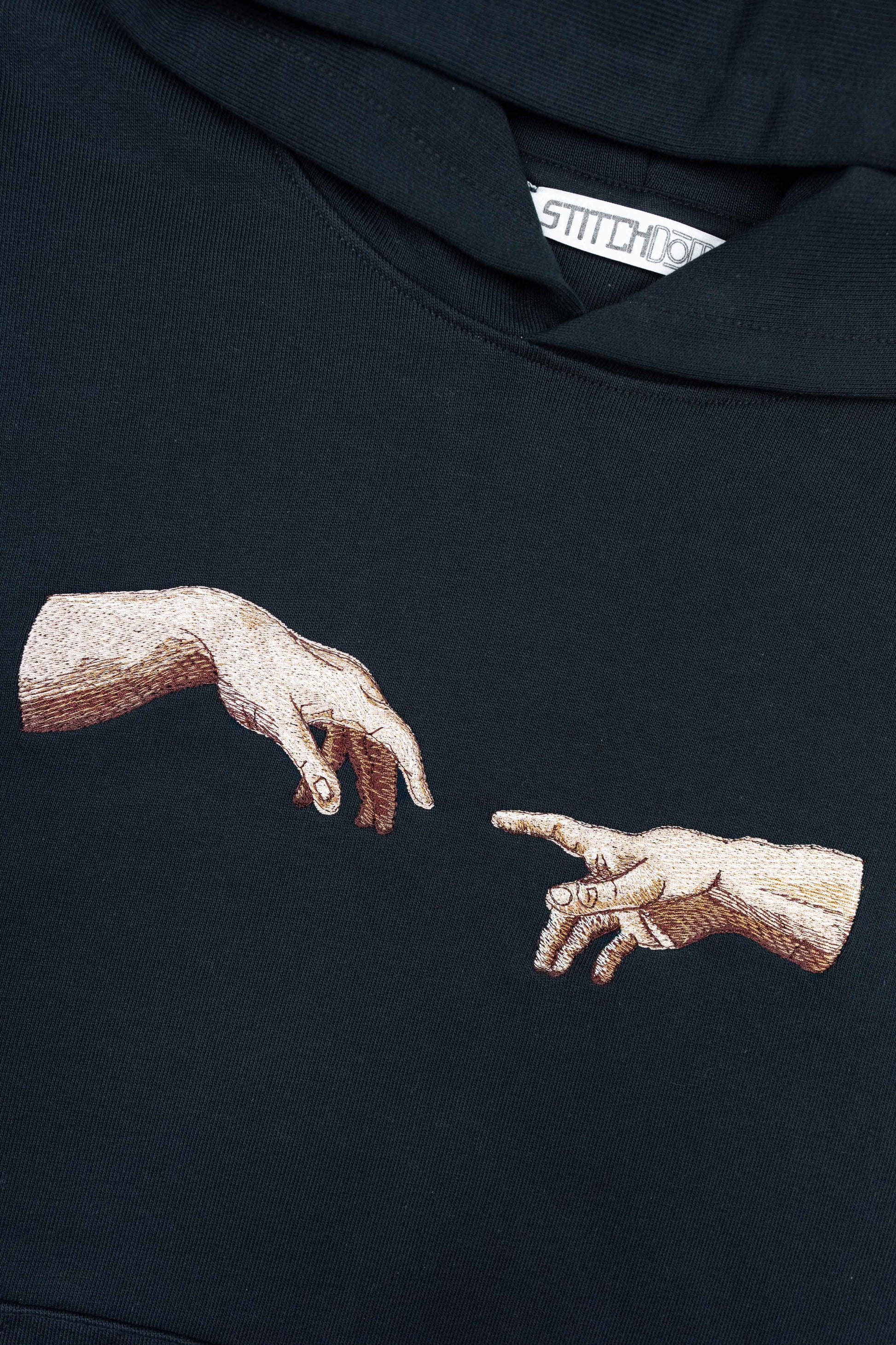 Unisex organic cotton hoodie featuring The Creation of Adam.