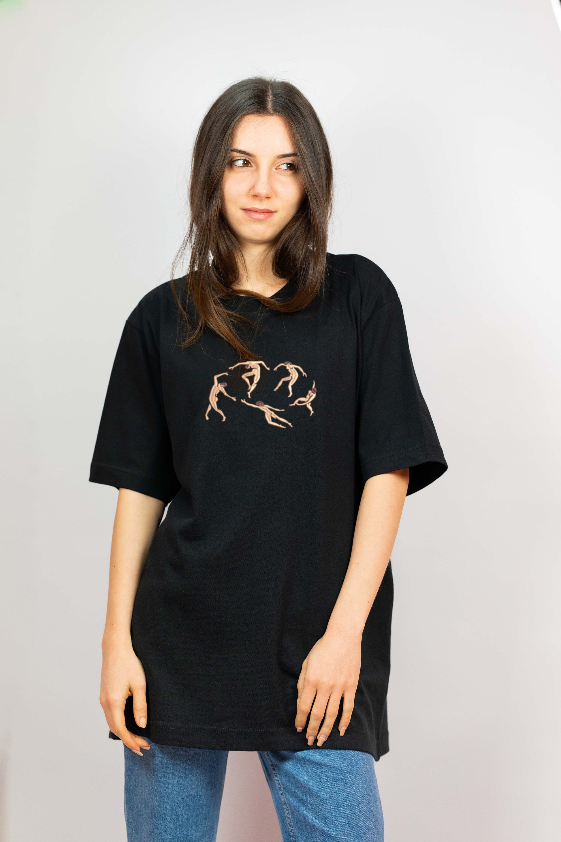 A unisex organic cotton t-shirt with fine embroidery depicting fluid human figures, inspired by Matisse’s iconic artwork. A stylish blend of vintage and modern aesthetics.