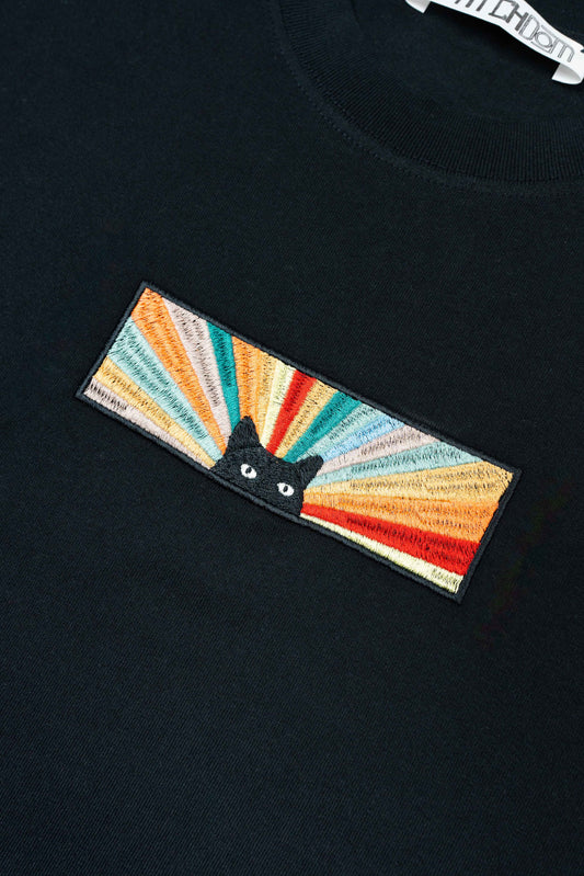 Unisex organic cotton t-shirt featuring a rainbow cat design.
