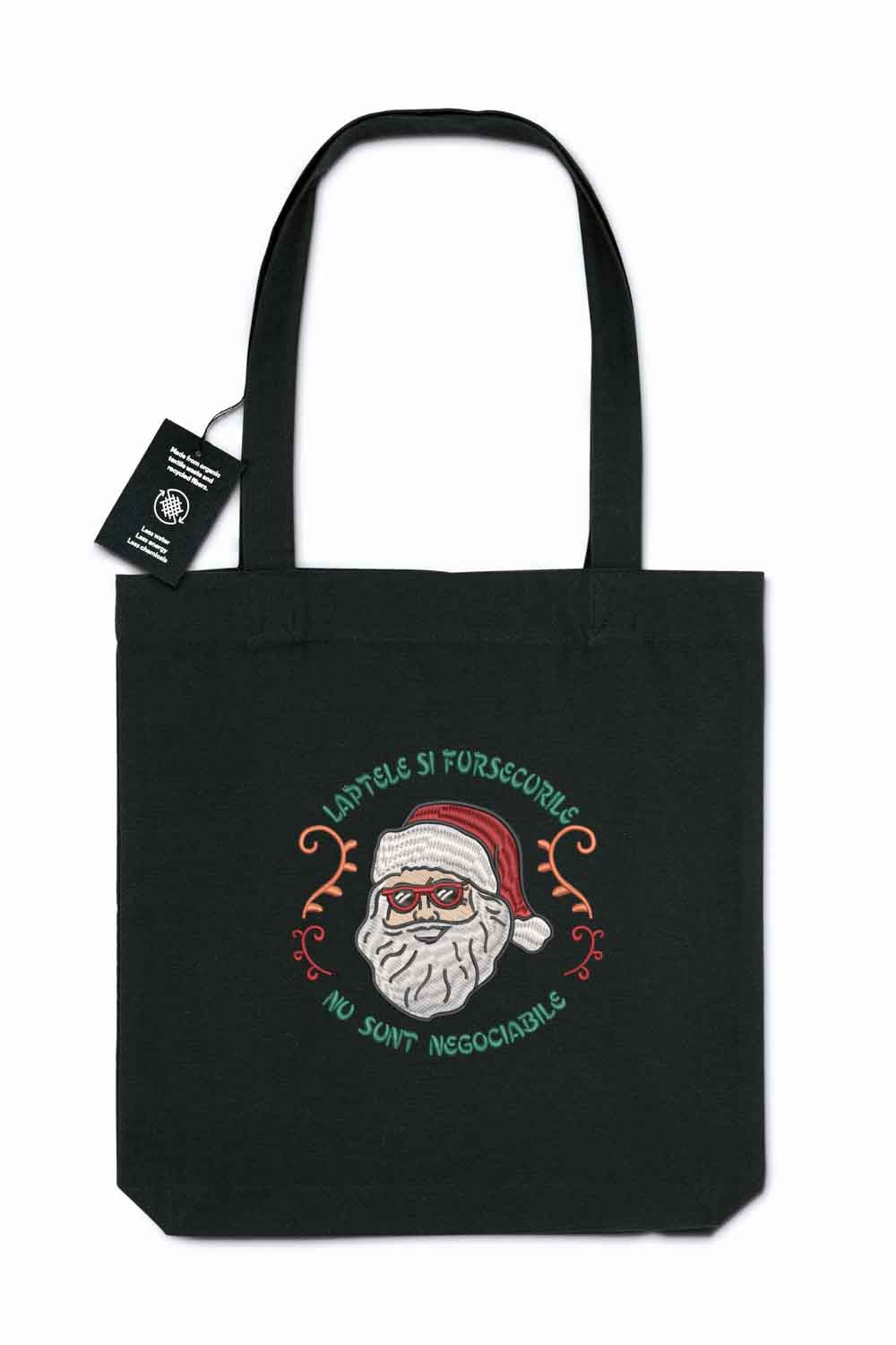 Tote bag brodat negru cu ilustrație de Moș Crăciun și mesaj amuzant despre lapte și fursecuri, un accesoriu festiv pentru perioada sărbătorilor.